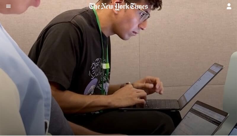 The New York Times article header showing CSU AI camp participants working on laptops